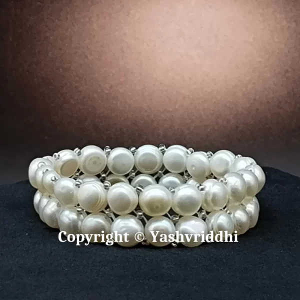 The Elegance Doubled: A Graceful Symphony in a Double Pearl Beads Bracelet